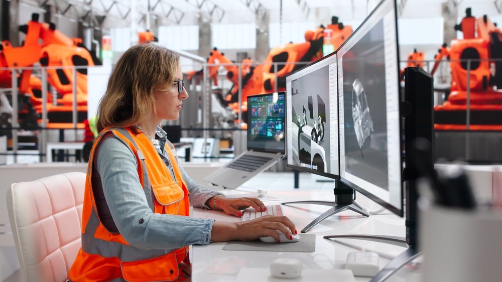 Engineer developing an electric drive system in CAD within a production environment