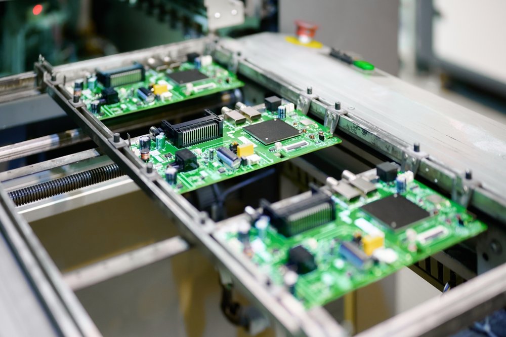 Automated electronics production line handling populated control boards