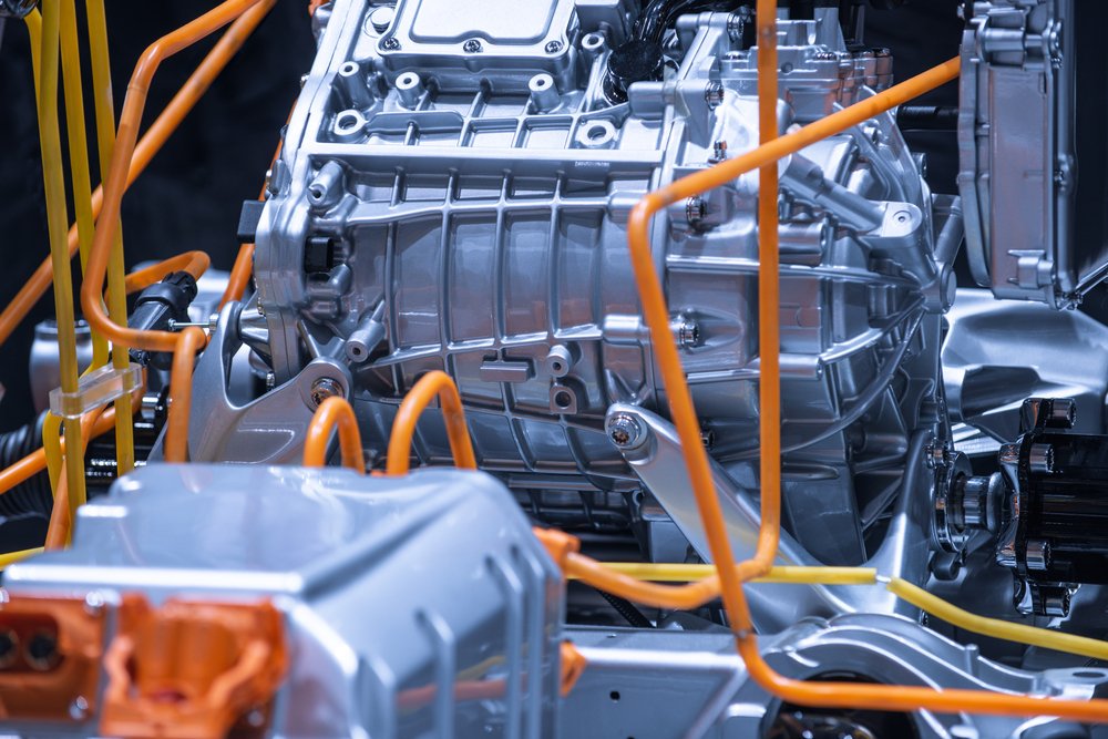 Close-up of an electric drive unit and orange high-voltage connections